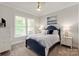 Bright bedroom featuring a blue sleigh bed, neutral walls, white trim, carpet and a ceiling fan at 1085 Wessington Manor Ln, Fort Mill, SC 29715