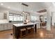 Spacious kitchen features an island with seating, modern appliances, stylish lighting, and an open layout at 1085 Wessington Manor Ln, Fort Mill, SC 29715