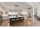 Open kitchen featuring a large island, white cabinets, stainless appliances, modern lighting, and hardwood floors at 1085 Wessington Manor Ln, Fort Mill, SC 29715