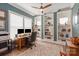 Charming home office featuring built-in bookshelves, natural light, and a comfortable workspace with tasteful decor at 1085 Wessington Manor Ln, Fort Mill, SC 29715