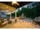 Beautiful outdoor living space with fireplace, comfortable seating, and dining area at 11024 Shreveport Dr, Huntersville, NC 28078