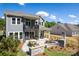 Spacious backyard features an outdoor kitchen, dining area, and a stone fireplace at 11024 Shreveport Dr, Huntersville, NC 28078
