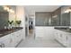 Elegant bathroom with double vanity, gray tile shower, and access to walk-in closet at 11024 Shreveport Dr, Huntersville, NC 28078