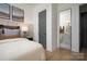 Tastefully decorated bedroom showing an ensuite bathroom at 11024 Shreveport Dr, Huntersville, NC 28078