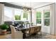Elegant dining room featuring stylish chandelier, windows with natural light, and seating for a delightful dining experience at 11024 Shreveport Dr, Huntersville, NC 28078