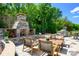 Outdoor stone fireplace with wood storage on a beautifully paved patio at 11024 Shreveport Dr, Huntersville, NC 28078