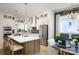 Elegant kitchen featuring a center island with seating, stainless steel appliances, and modern pendant lighting at 11024 Shreveport Dr, Huntersville, NC 28078