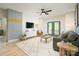 Airy living room with modern furniture, television, and a view of the patio through sliding glass doors at 11024 Shreveport Dr, Huntersville, NC 28078