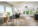 Bright main bedroom with large windows, a cozy rug, and stylish furniture creates a relaxing retreat at 11024 Shreveport Dr, Huntersville, NC 28078