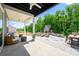 Covered patio with a cozy seating area and an outdoor stone fireplace for relaxation at 11024 Shreveport Dr, Huntersville, NC 28078