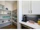 Well-organized pantry with white shelving, offering ample storage space and complementing the kitchen's design at 11024 Shreveport Dr, Huntersville, NC 28078