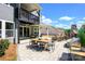 Expansive patio offers an outdoor dining area and a stone fireplace at 11024 Shreveport Dr, Huntersville, NC 28078