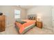 Cozy bedroom with neutral tones, a comfortable bed and window with natural light at 113 Summerhill Dr, Mooresville, NC 28115