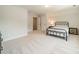 Spacious bedroom with neutral walls, plush carpet, a black metal bed frame and a dresser at 113 Summerhill Dr, Mooresville, NC 28115