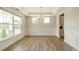 Spacious dining room featuring hardwood floors and modern chandelier at 113 Summerhill Dr, Mooresville, NC 28115