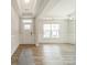 Entryway with wainscoting, a large window, and hardwood floors at 113 Summerhill Dr, Mooresville, NC 28115