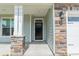 Close up of front door with stone pillar and the house number 113 at 113 Summerhill Dr, Mooresville, NC 28115