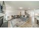 Comfortable living room with fireplace, large couch, and stylish area rug at 113 Summerhill Dr, Mooresville, NC 28115