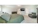 Comfortable main bedroom with a dresser, recliner, and TV for relaxing after a long day at 113 Summerhill Dr, Mooresville, NC 28115