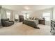 Spacious main bedroom with plush carpet, neutral walls, and ample natural light from multiple windows at 113 Summerhill Dr, Mooresville, NC 28115