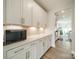 Spacious pantry area featuring lots of storage, countertops, and convenient access to the kitchen at 113 Summerhill Dr, Mooresville, NC 28115