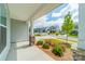 View from the porch showing landscaping and street with houses in the background at 113 Summerhill Dr, Mooresville, NC 28115