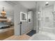 Bright bathroom featuring a glass-enclosed shower, soaking tub, and modern fixtures at 1160 S Kings Dr, Charlotte, NC 28207