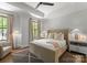 Bedroom boasts a tray ceiling, neutral color scheme, and stylish furnishings at 1160 S Kings Dr, Charlotte, NC 28207