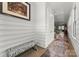 Bright hallway with a zebra-striped bench, stylish runner rug, and modern wall accents at 1160 S Kings Dr, Charlotte, NC 28207