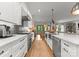 Bright kitchen showcasing granite countertops, stylish cabinets, and open access to the living area at 1160 S Kings Dr, Charlotte, NC 28207