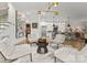Open-concept living room featuring modern decor, plush seating, and a seamless flow to the kitchen at 1160 S Kings Dr, Charlotte, NC 28207