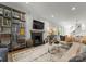 Bright living room features a fireplace, built-in shelving, and a stylish area rug at 1160 S Kings Dr, Charlotte, NC 28207