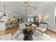 Open-concept living area featuring a bright, modern design and seamless flow to the kitchen and outdoors at 1160 S Kings Dr, Charlotte, NC 28207