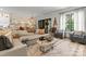 Cozy living room featuring a comfortable sofa, elegant decor, and a tranquil view at 1160 S Kings Dr, Charlotte, NC 28207