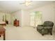 Spacious bedroom with neutral carpet, large windows, and comfortable seating area creates a relaxing retreat at 1209 S South St, Gastonia, NC 28052
