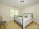 Bright bedroom with comfortable bed, chair and ample natural light creates a relaxing retreat at 1209 S South St, Gastonia, NC 28052