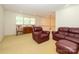 Bright living room with comfortable leather furniture and open floor plan is perfect for entertaining at 1209 S South St, Gastonia, NC 28052