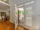 Open double doors lead to the brick patio with white columns, furniture, and a view of the sparkling pool at 1209 S South St, Gastonia, NC 28052