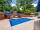 Relaxing backyard pool area with a brick wall, gazebo, and mature landscaping at 1209 S South St, Gastonia, NC 28052
