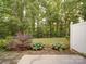 Backyard features a patio and a well manicured lawn at 12231 Stratfield Place Cir, Pineville, NC 28134