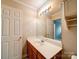 Clean bathroom with a vanity and a large mirror, offering a bright and functional space at 12231 Stratfield Place Cir, Pineville, NC 28134