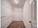 Walk-in closet with wire shelving, providing organized storage space for clothing and accessories at 12231 Stratfield Place Cir, Pineville, NC 28134