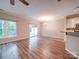 Open dining area with luxury vinyl plank floors, modern lighting, and sliding glass doors at 12231 Stratfield Place Cir, Pineville, NC 28134