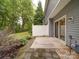 Back patio with mature landscaping at 12231 Stratfield Place Cir, Pineville, NC 28134