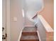 Carpeted staircase with white railing leading to the upper level of this charming home at 12231 Stratfield Place Cir, Pineville, NC 28134