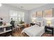 Bright bedroom provides a workspace with a large window overlooking the backyard at 1410 Swaying Branch Ln, Clover, SC 29710