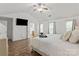 Bright bedroom with vaulted ceilings, wood-look floors, and access to the bathroom at 1410 Swaying Branch Ln, Clover, SC 29710