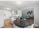 Cozy dining room with natural light showcases the breakfast bar and white appliances at 1410 Swaying Branch Ln, Clover, SC 29710