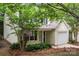 Charming two-story home featuring a garage and a well-manicured front yard at 1410 Swaying Branch Ln, Clover, SC 29710