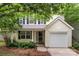 Charming two-story home featuring a garage and a well-manicured front yard at 1410 Swaying Branch Ln, Clover, SC 29710